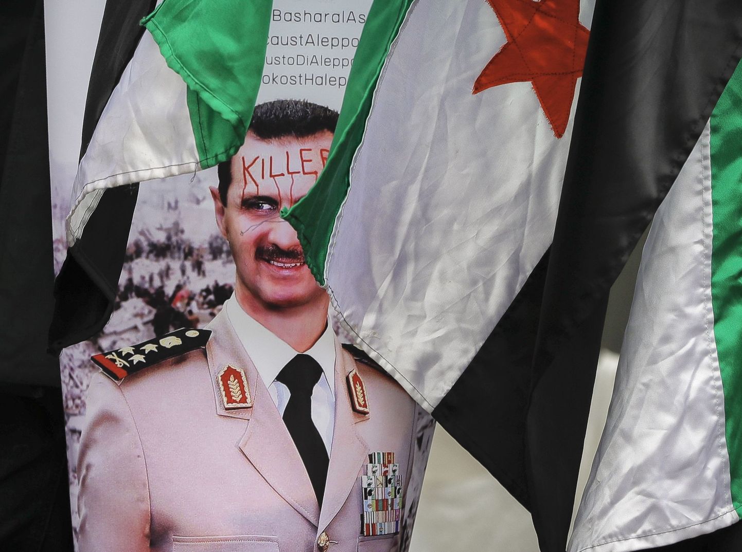 Plakat Bashar al-Assadi pildiga.