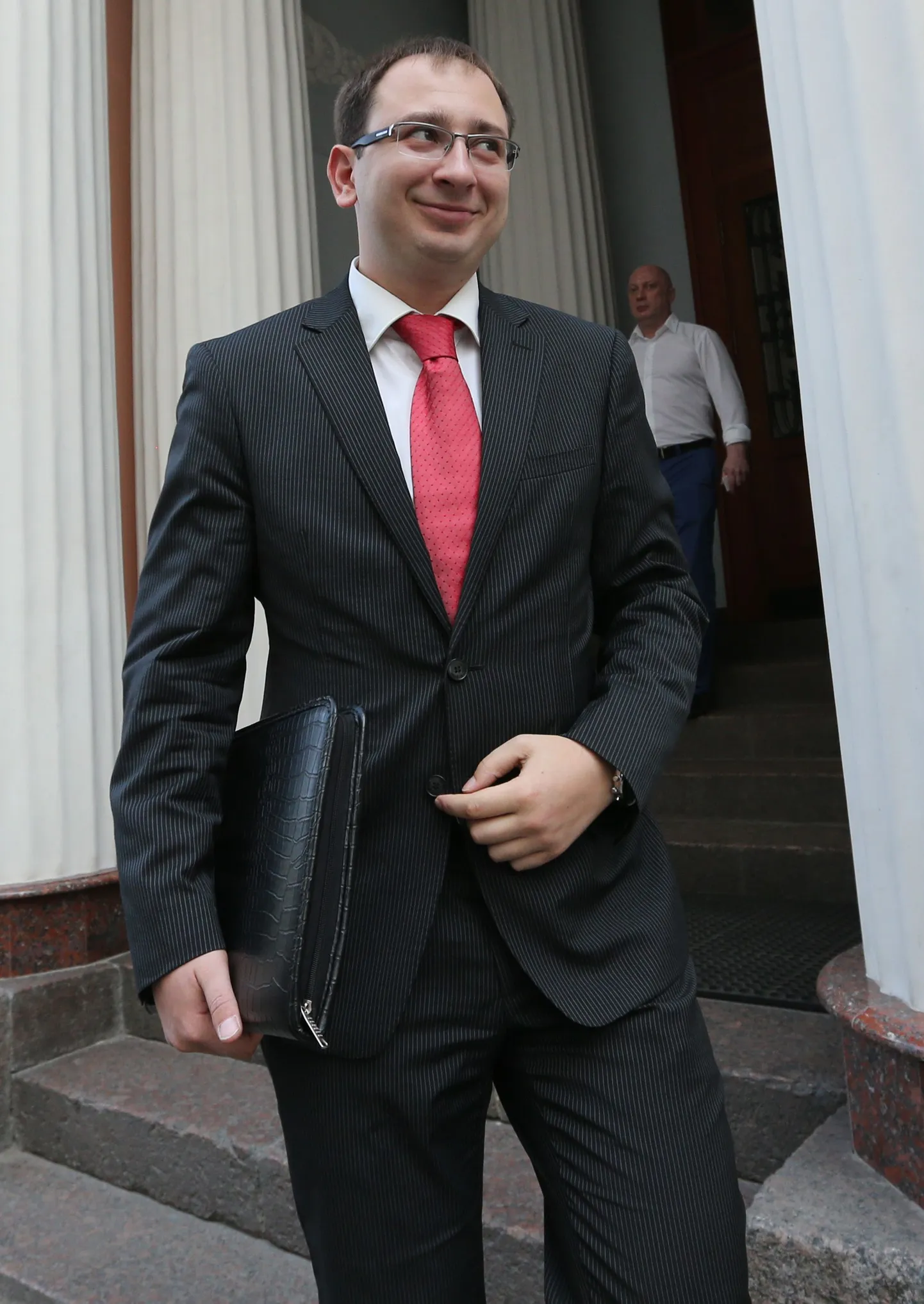 ITAR-TASS: MOSCOW, RUSSIA. AUGUST 8, 2013. Lawyer Nikolai Polozov arrives at the offices of the Moscow Bar Association for a meeting to look into a complaint by Pussy Riot member Yekaterina Samutsevich. Samutsevich has filed a complaint against Nikolai Polozov and Mark Feigin over what she claims to be misconduct and demanded that the two lawyers be stripped of their right to practice. Polozov and Feigin represented Pussy Riot members during their trial for their controversial  performance at the Cathedral of Christ the Saviour in February 2012. The Moscow Bar Association has adjourned hearing of the complaint till 18 September 2013. (Photo ITAR-TASS / Alexei Nikolsky)