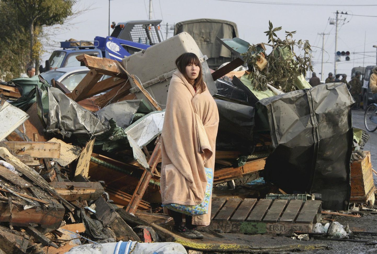 Kuulsaks saanud foto Jaapani 2011. aasta maavärinast. Sellel on näha ema, kes otsis oma last