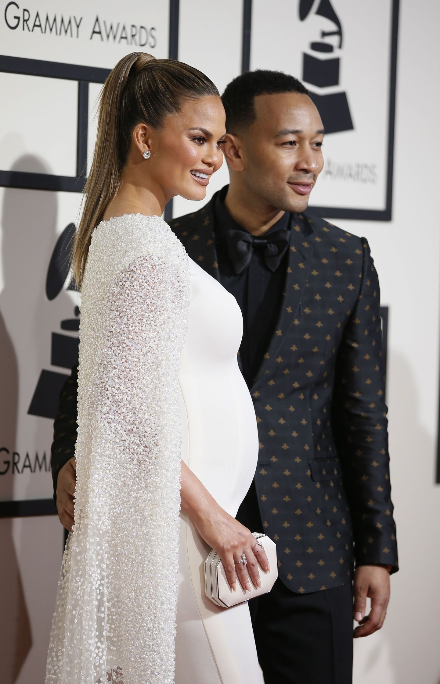 Model Chrissy Teigan and musician John Legend arrive at the 58th Grammy Awards in Los Angeles, California February 15, 2016.  REUTERS/Danny Moloshok