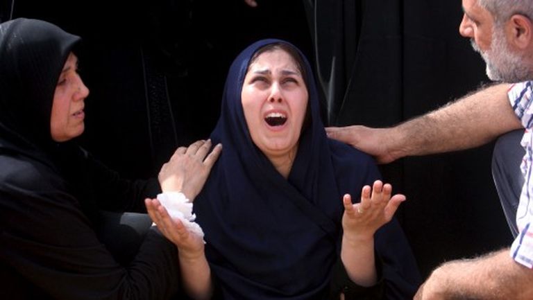 9 сентября 2015 года. Иракская женщина оплакивает своих детей, которые утонули, пытаясь бежать в Грецию 