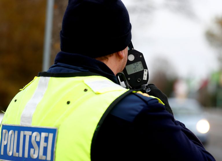 Estonian police officer Aimar Luik measures car speed in Parnu, Estonia October 30, 2018. Picture taken October 30, 2018. REUTERS/Ints Kalnins