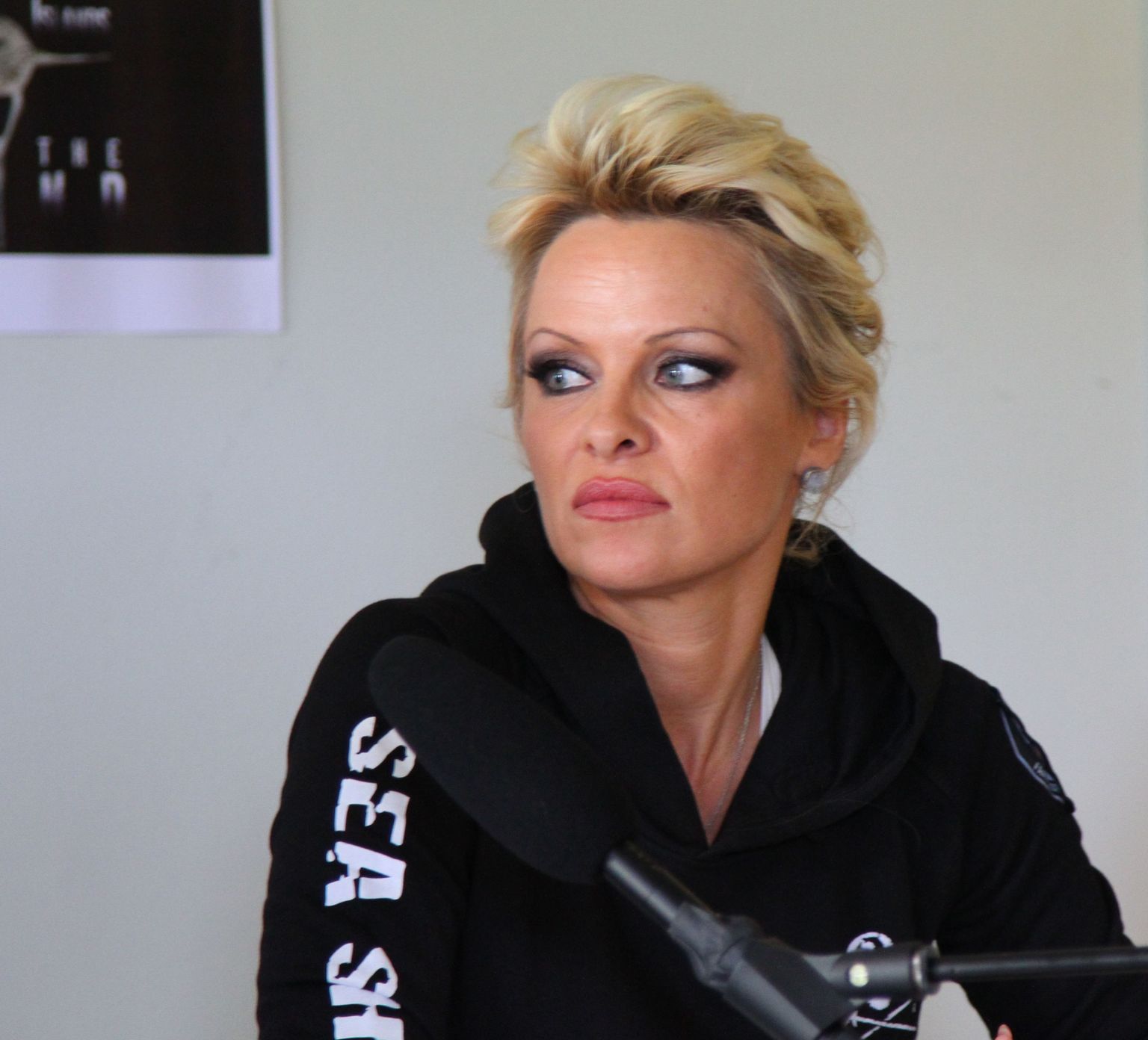 Actress and animal rights activist Pamela Anderson holds a press conference in Torshavn at the Faeroe Islands on Friday, Aug.1, 2014. She traveled to the islands to support a campaign by Seattle-based Sea Shepherd Conservation Society opposing the drives of pilot whales that date from the late 16th century. (AP Photo/POLFOTO, Sigmar Morkore, Sosialurin) DENMARK OUT / TT / kod 436