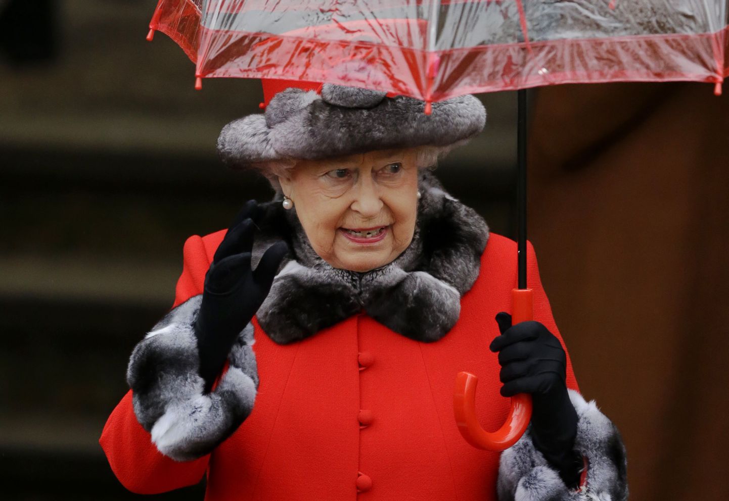 Britain's Queen Elizabeth II waves at the crowd of well-wishers as she leaves after attending the British royal family's traditional Christmas Day church service at St. Mary Magdalene Church in Sandringham, England, Friday, Dec. 25, 2015.  (AP Photo/Matt Dunham)