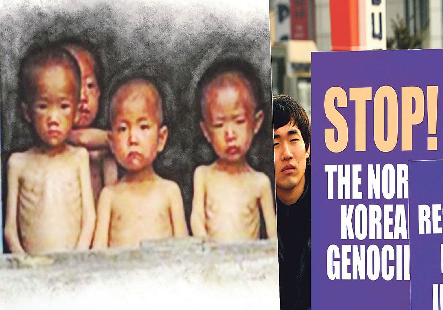 В южнокорейском Сеуле демонстрант с транспарантом, на котором изображены голодающие дети, требует прекращения геноцида в Северной Корее.