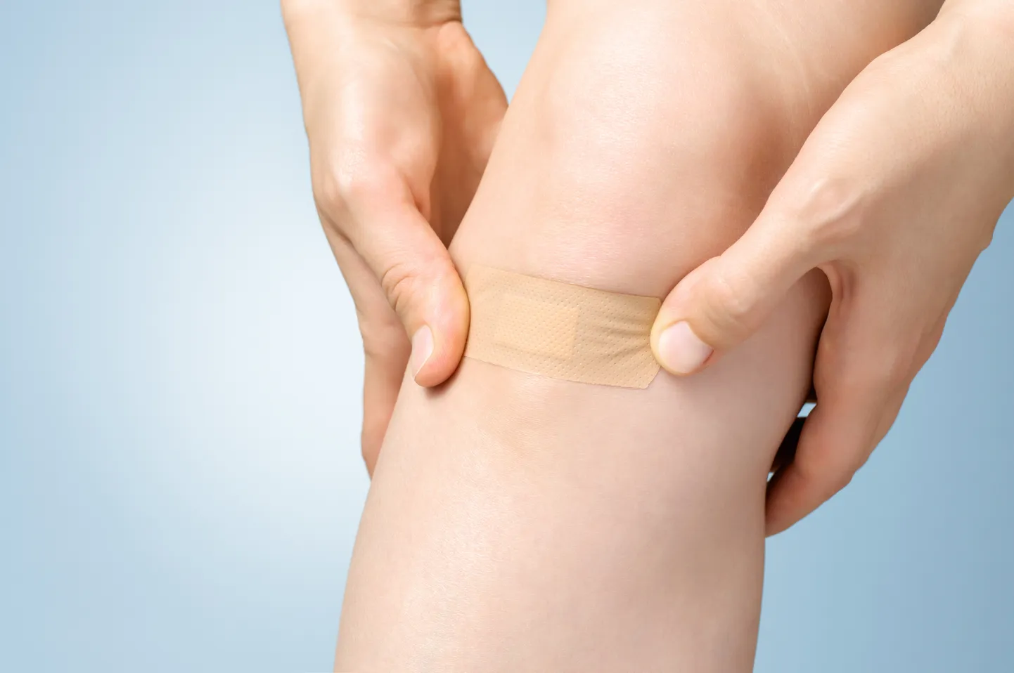 Plaster on female leg