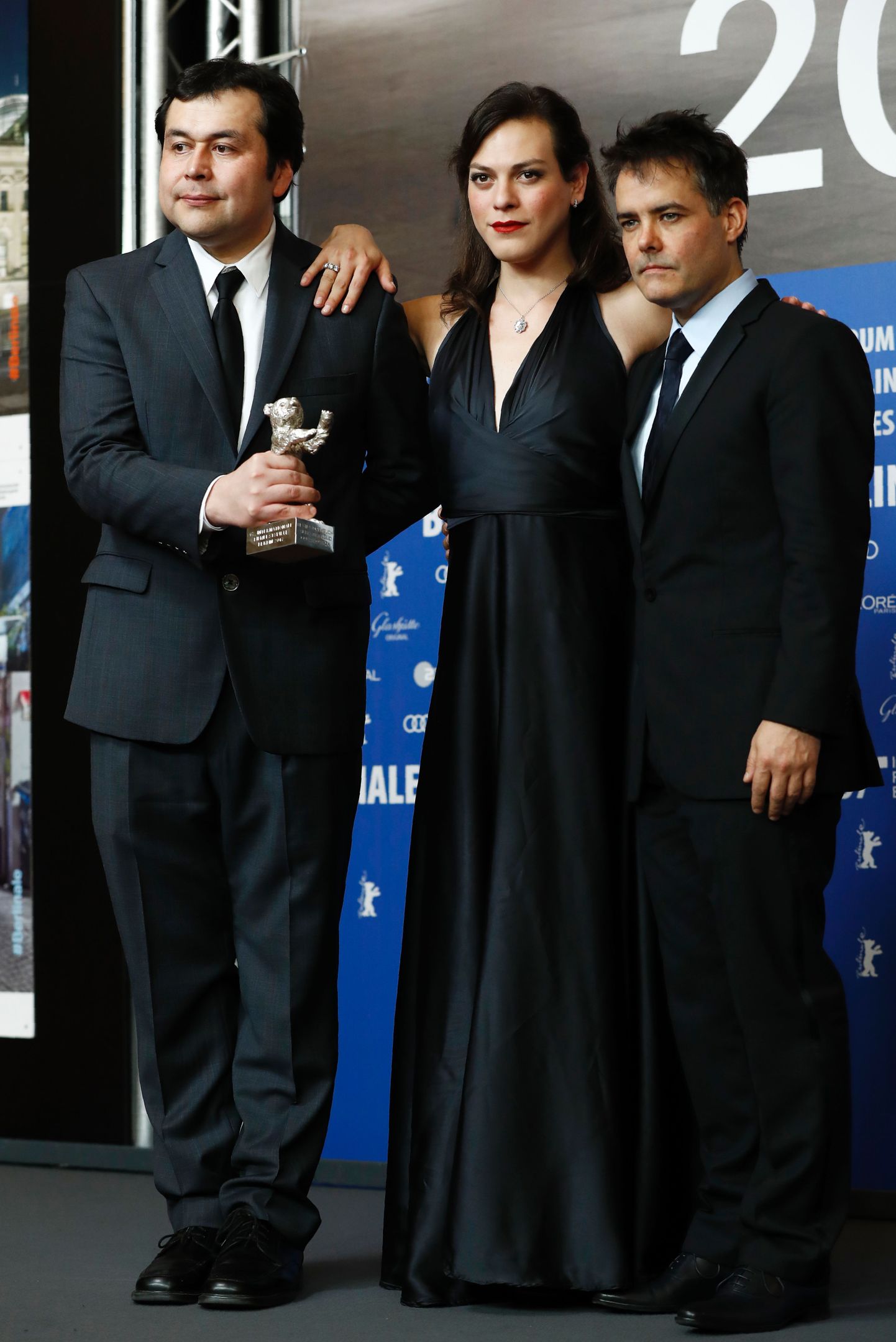 (L-R) Screenwriter Gonzalo Maza, Colombian actress Daniela Vega and Chilean director Sebastian Lelio pose during a press conference after being awarded with the Silver bear for best screenplay for their movie "A Fantastic Woman (Una mujer fant
