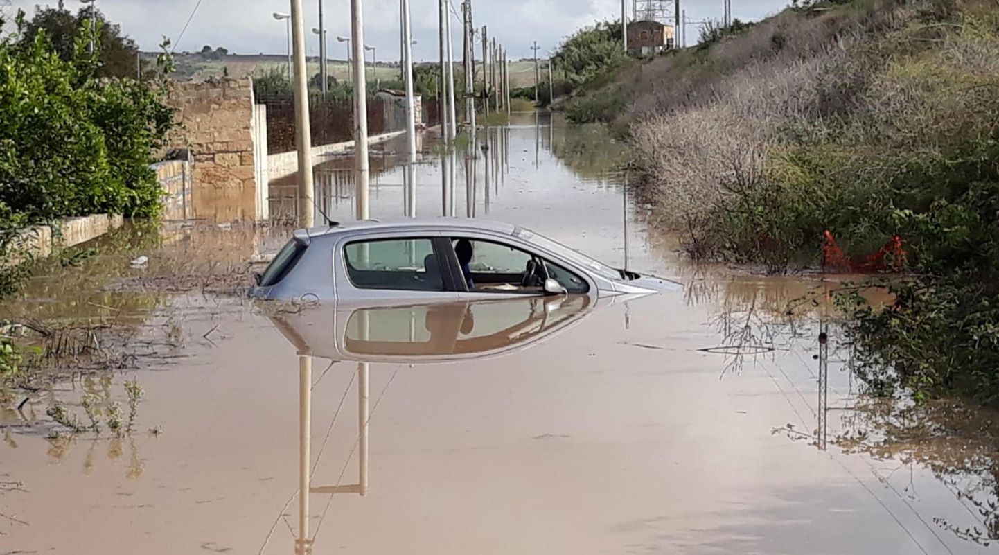 A car is seen submerged at a street after a violent storms that hit eastern Sicily between 18 and 19 October, in Syracuse, near Catania, southern Italy, 19 October 2018. The areas affected the most by bad weather and flooding were Francoforte, Lentini and Sigonella.  EPA/MIMMO TROVATO