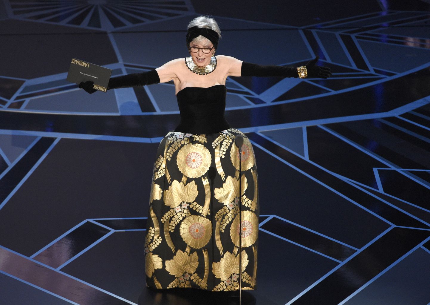 Rita Moreno presents the award for best foreign language film at the Oscars on Sunday, March 4, 2018, at the Dolby Theatre in Los Angeles. (Photo by Chris Pizzello/Invision/AP)