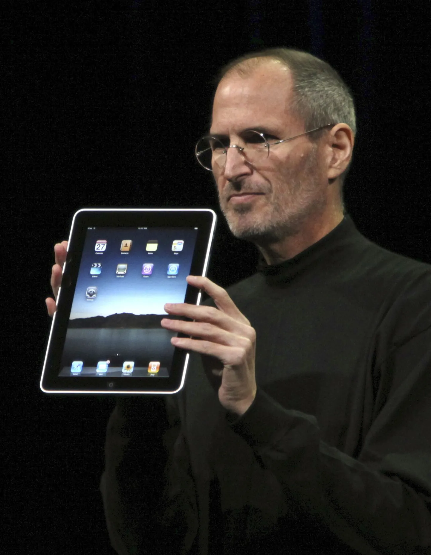 Apple'i juht Steve Jobs ja firma uus tahvelarvuti iPad.