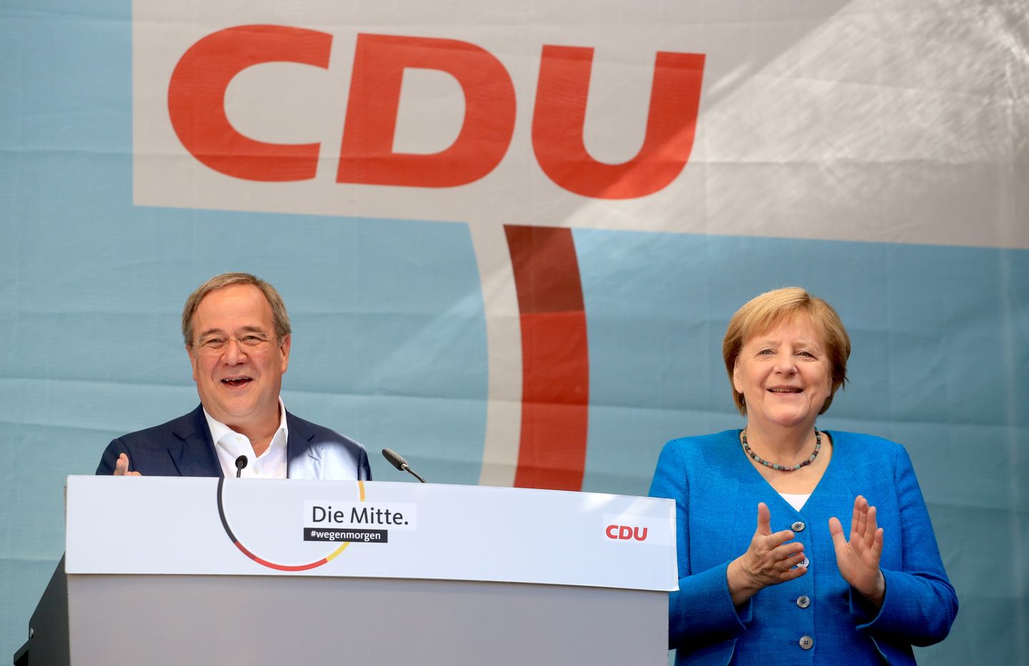Vācijas kanclere Angela Merkele un CDU kanclera kandidāts Armīns Lašets