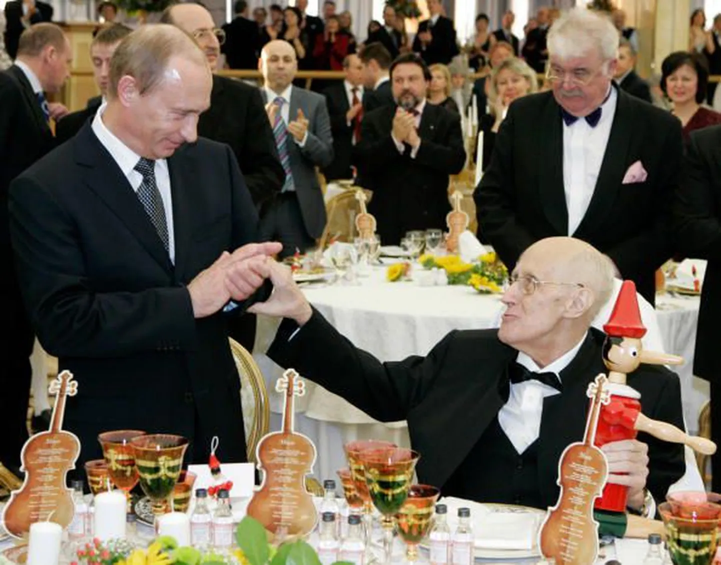 Putin ja pidulised.