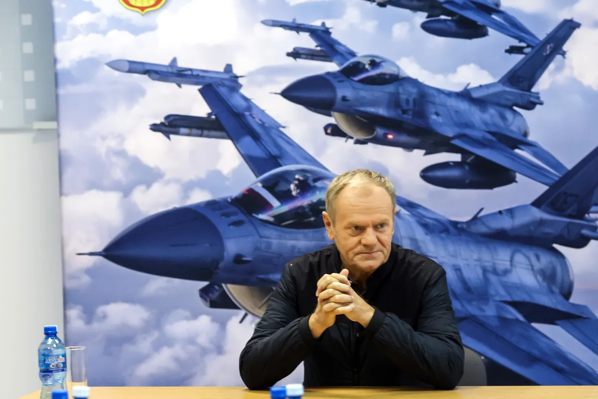 Polish Prime Minister Donald Tusk attends a meeting with air force personnel during a visit to the 32nd Tactical Air Base in Lask, Poland, 11 September 2025, a day after the military shot down some of the Russian drones that violated Polish airspace.&nbsp;Photo: Marian Zubrzycki