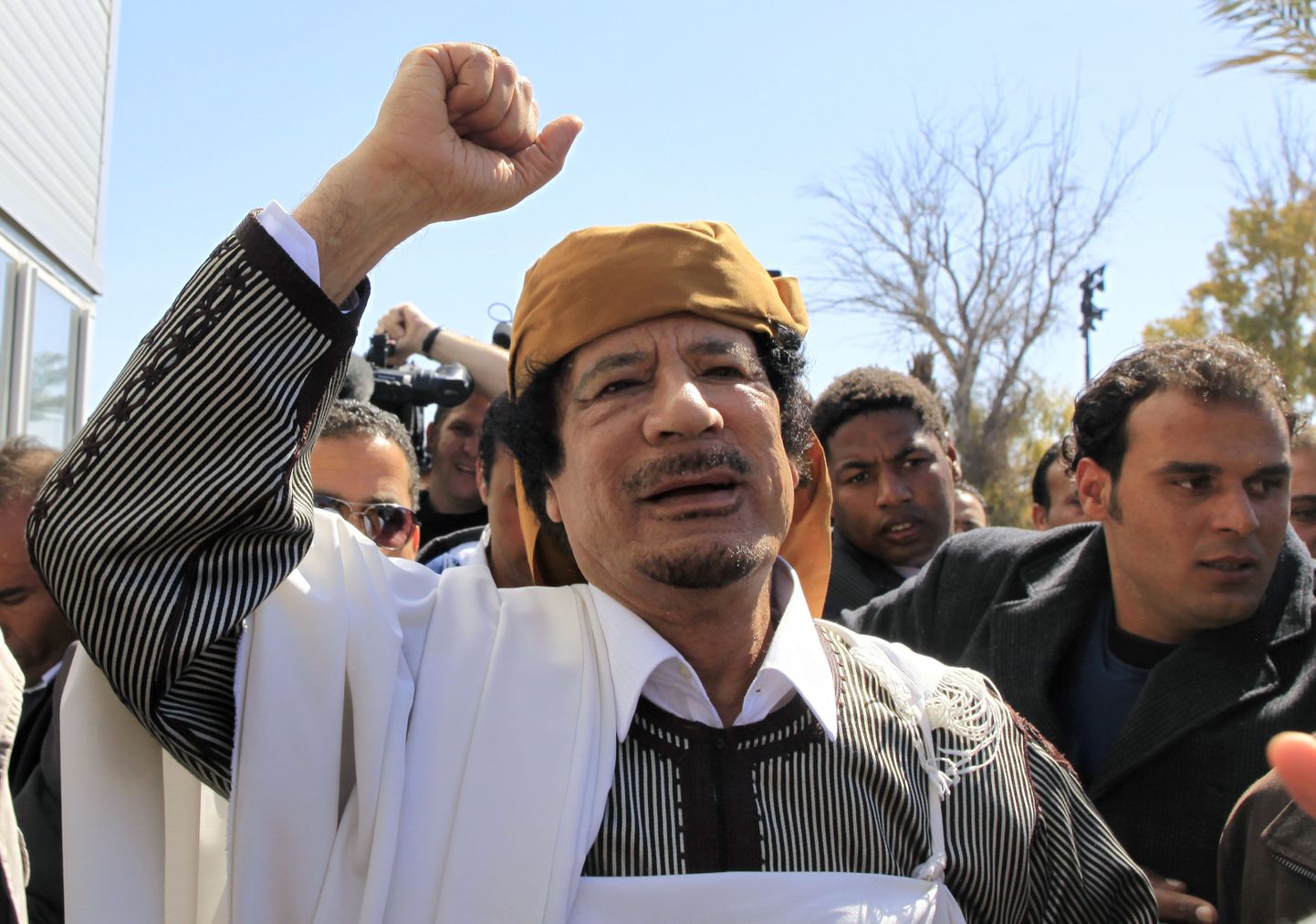 Muammar Gaddafi.