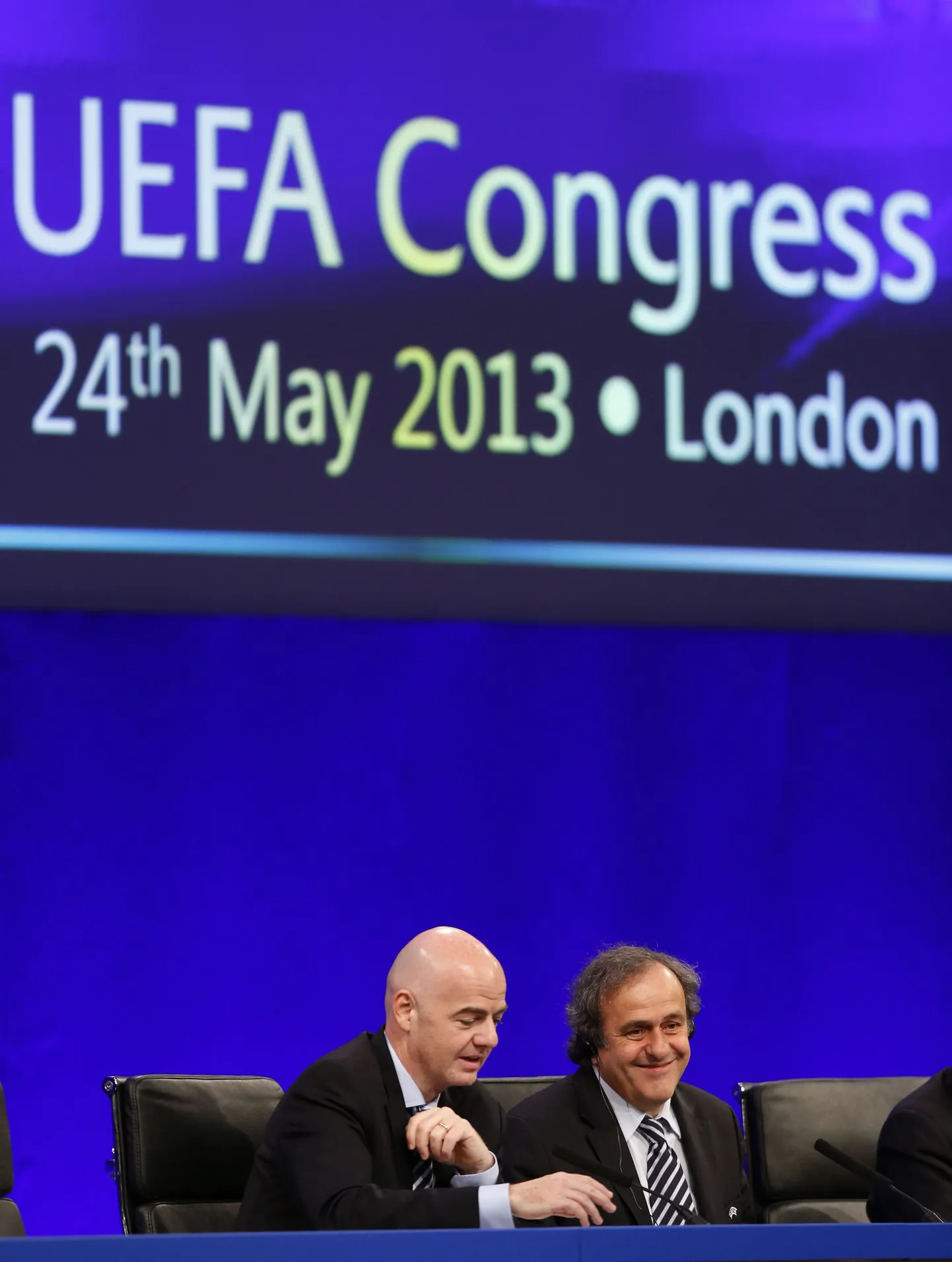 UEFA President Michel Platini, right, and UEFA General Secrtary Gianni Infantino speak to members of the media at the end of the 37th Ordinary UEFA Congress in London, Friday, May 24, 2013. (AP Photo/Sang Tan) / SCANPIX Code: 436