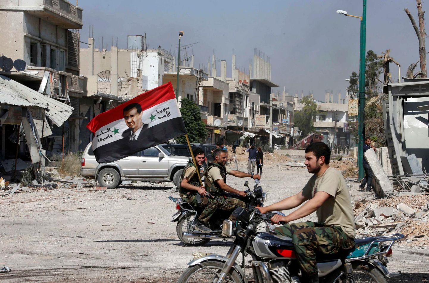 President Bashar al-Assadile lojaalsed väed pärast Qusairi linna mässulistelt tagasi võtmist 2013. aastal.