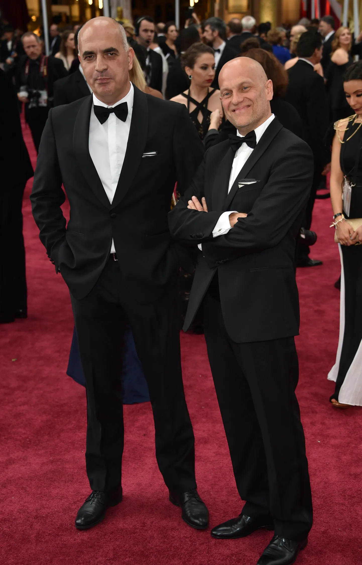 Nominee for Best Foreign Language Film "Tangerines" (Estonia) Zaza Urushadze (L) and Ivo Felt arrive on the red carpet for the 87th Oscars on February 22, 2015 in Hollywood, California. AFP PHOTO / MLADEN ANTONOV