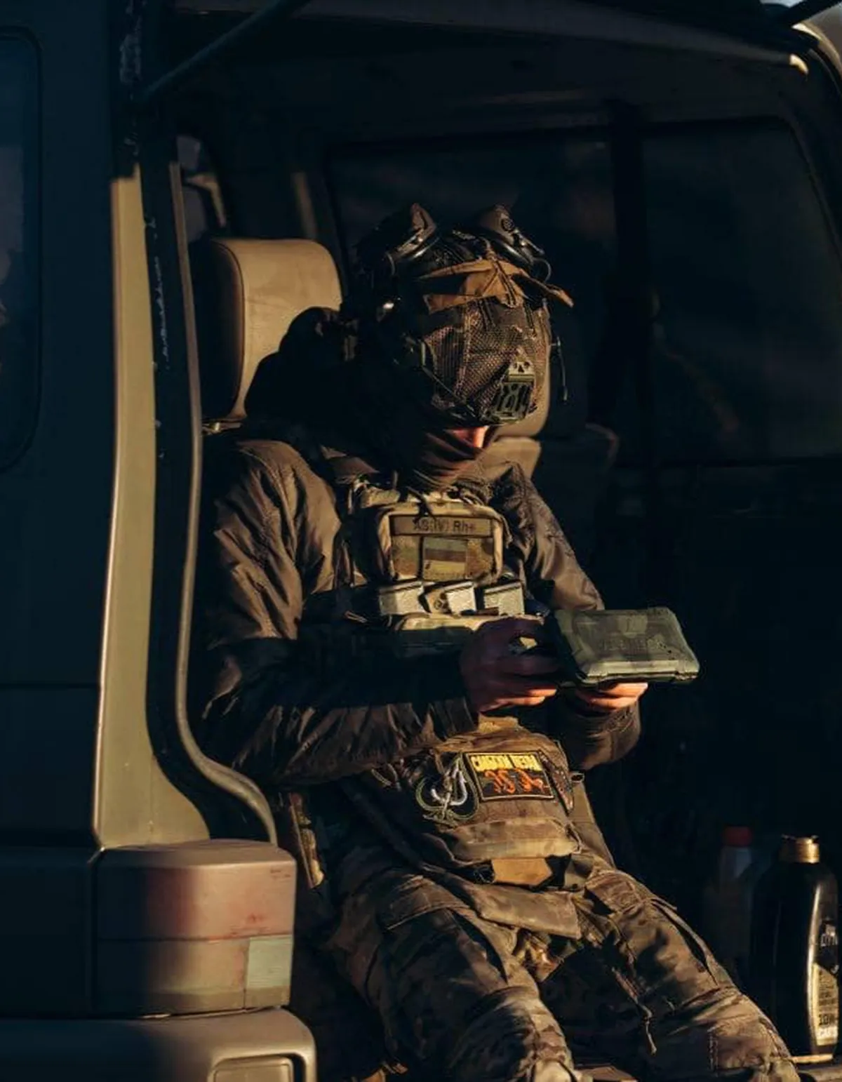 Picasso monitors a drone flight on a tablet from a dugout near the front line.
