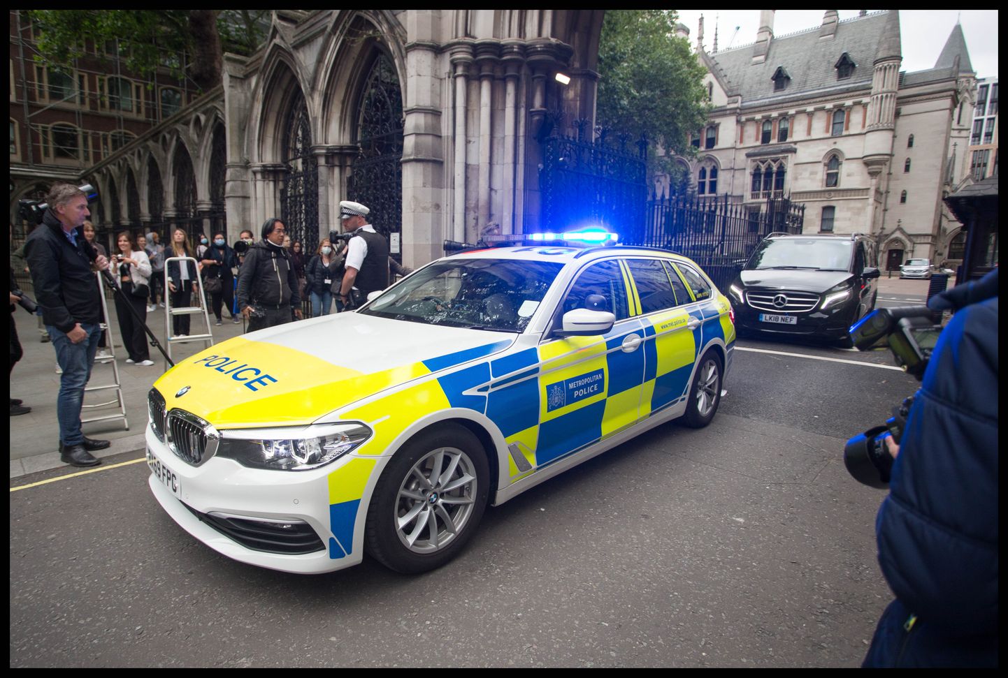 July 15, 2020, London, London, United Kingdom: Johnny Depp libel trial-Day Seven. ..Police escort Amber HeardÃ•s vehicle away from the Royal Courts of Justice following day seven of the Johnny Depp libel trial. (Credit Image: © Martyn Wheatley/i-Images via ZUMA Press)
