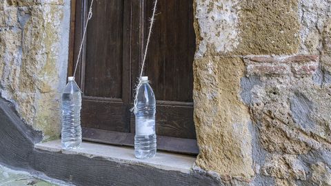 Water-filled plastic bottles outside Italian homes: Why you should never touch them
