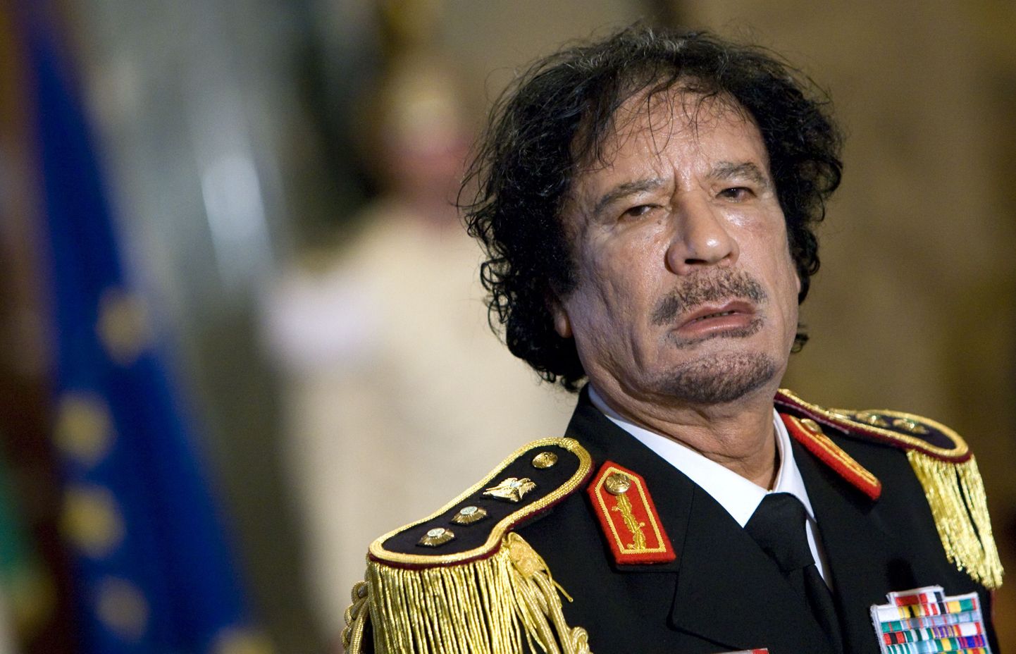 Муаммар Каддафи.
