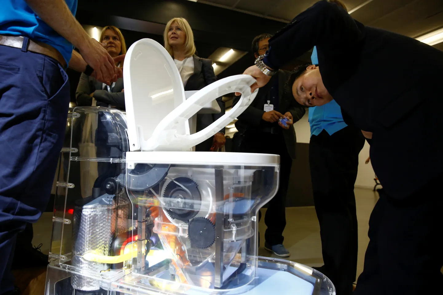 A man looks at a toilet design by Cranfield University at the Reinvented Toilet Expo showcasing sewerless sanitation technology in Beijing, China November 6, 2018. REUTERS/Thomas Peter