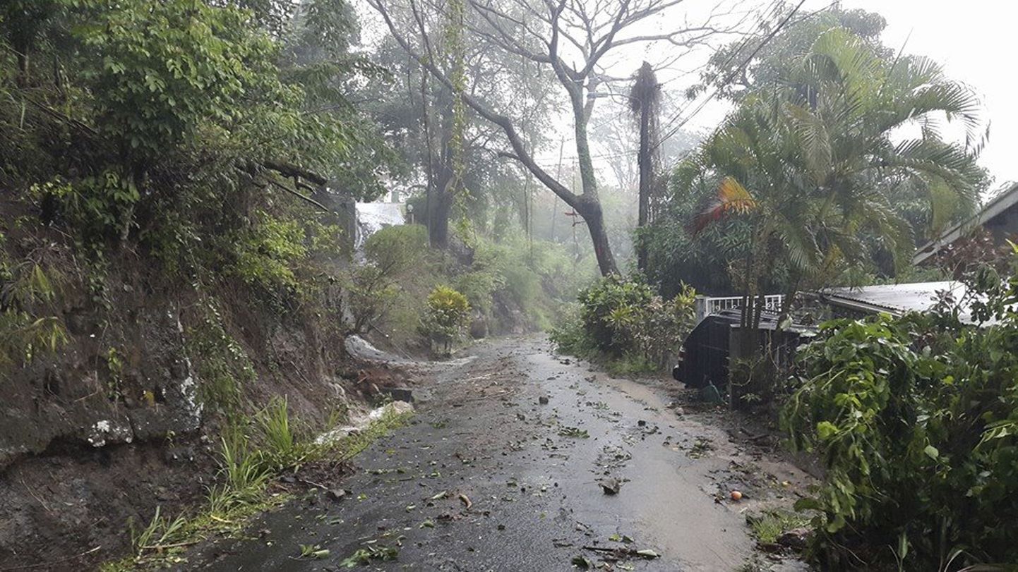 Debris covers a road after heavy rains from Tropical Storm Erika hit the Caribbean island of Dominica in this picture from Robert Tonge, Dominican Minister for Tourism and Urban Renewal, taken August 27, 2015. Tropical Storm Erika strengthened as it dumped torrential rain on islands in the Eastern Caribbean and appeared to be headed for the U.S. East Coast early next week, the U.S. National Hurricane Center said on Thursday.  REUTERS/Robert Tonge, Dominican Minister for Tourism and Urban Renewal/Handout via Reuters  THIS IMAGE HAS BEEN SUPPLIED BY A THIRD PARTY. IT IS DISTRIBUTED, EXACTLY AS RECEIVED BY REUTERS, AS A SERVICE TO CLIENTS. FOR EDITORIAL USE ONLY. NOT FOR SALE FOR MARKETING OR ADVERTISING CAMPAIGNS