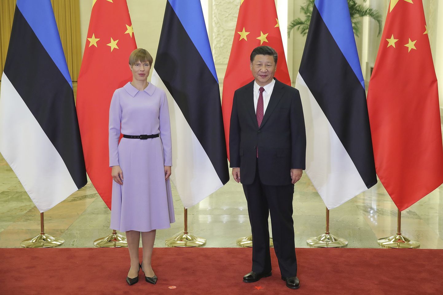 President of Estonia Kersti Kaljulaid, left, shakes hands with Chinese President Xi Jinping at the Great Hall Of The People on Tuesday, Sept. 18, 2018, in Beijing. (Lintao Zhang/Pool Photo via AP)