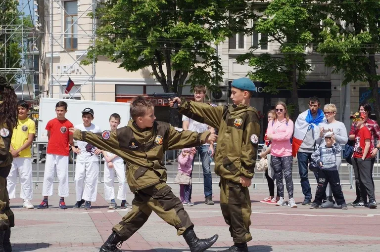 The Kremlin's terrorist regime has militarized Russian society and systematically promotes a national culture of death. The photo shows children playing war games in occupied Crimea. Photo: