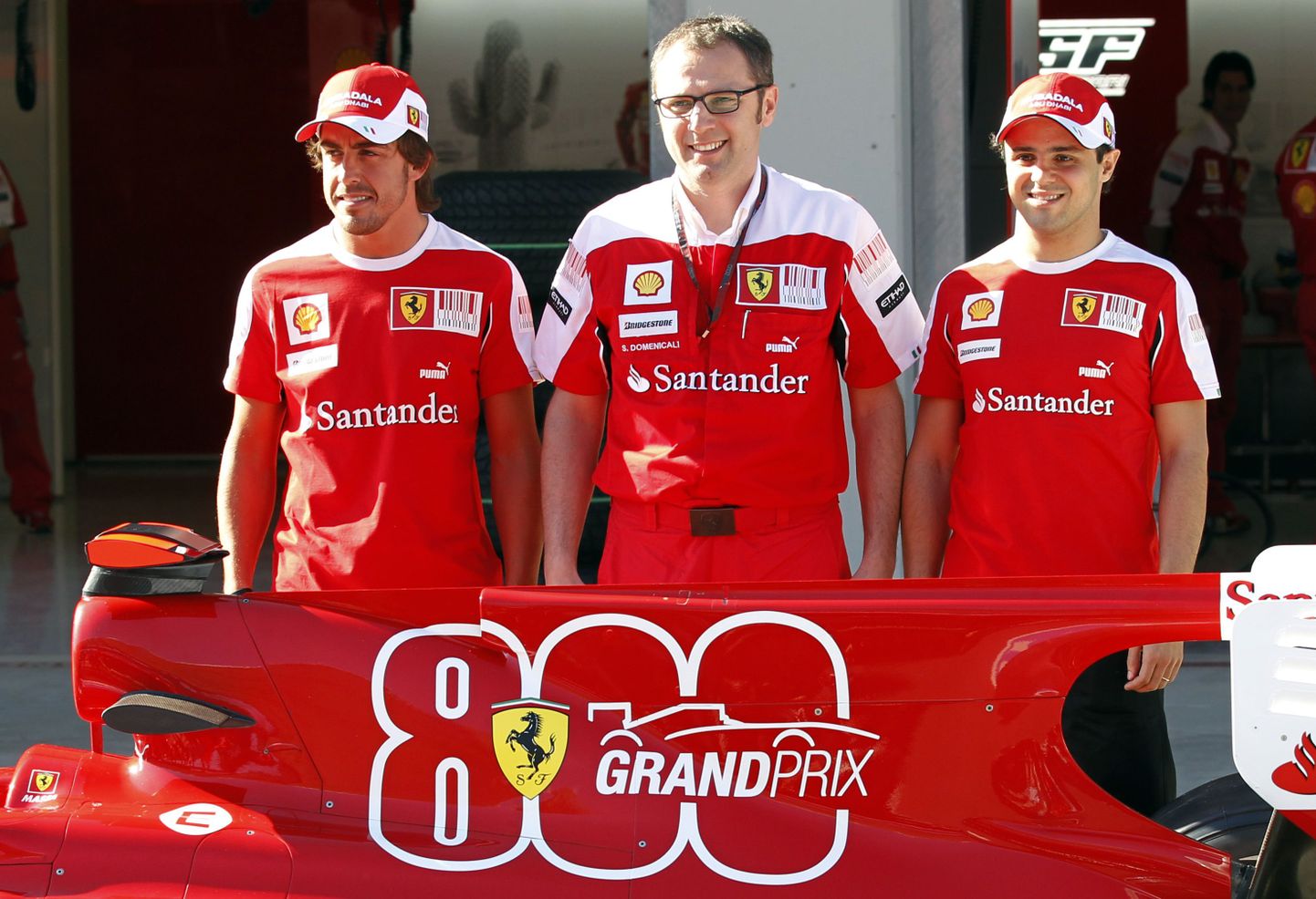 Fernando Alonso (vasakult), Stefano Domenicali ja Felipe Massa.