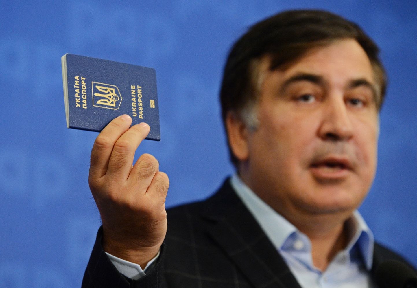 3188390 09/08/2017 Mikheil Sakashvili, leader if the New Forces Movement and former head of the Odessa region, shows his Ukrainian passport during a news conference in Warsaw. Alexey Vitvitsky/Sputnik