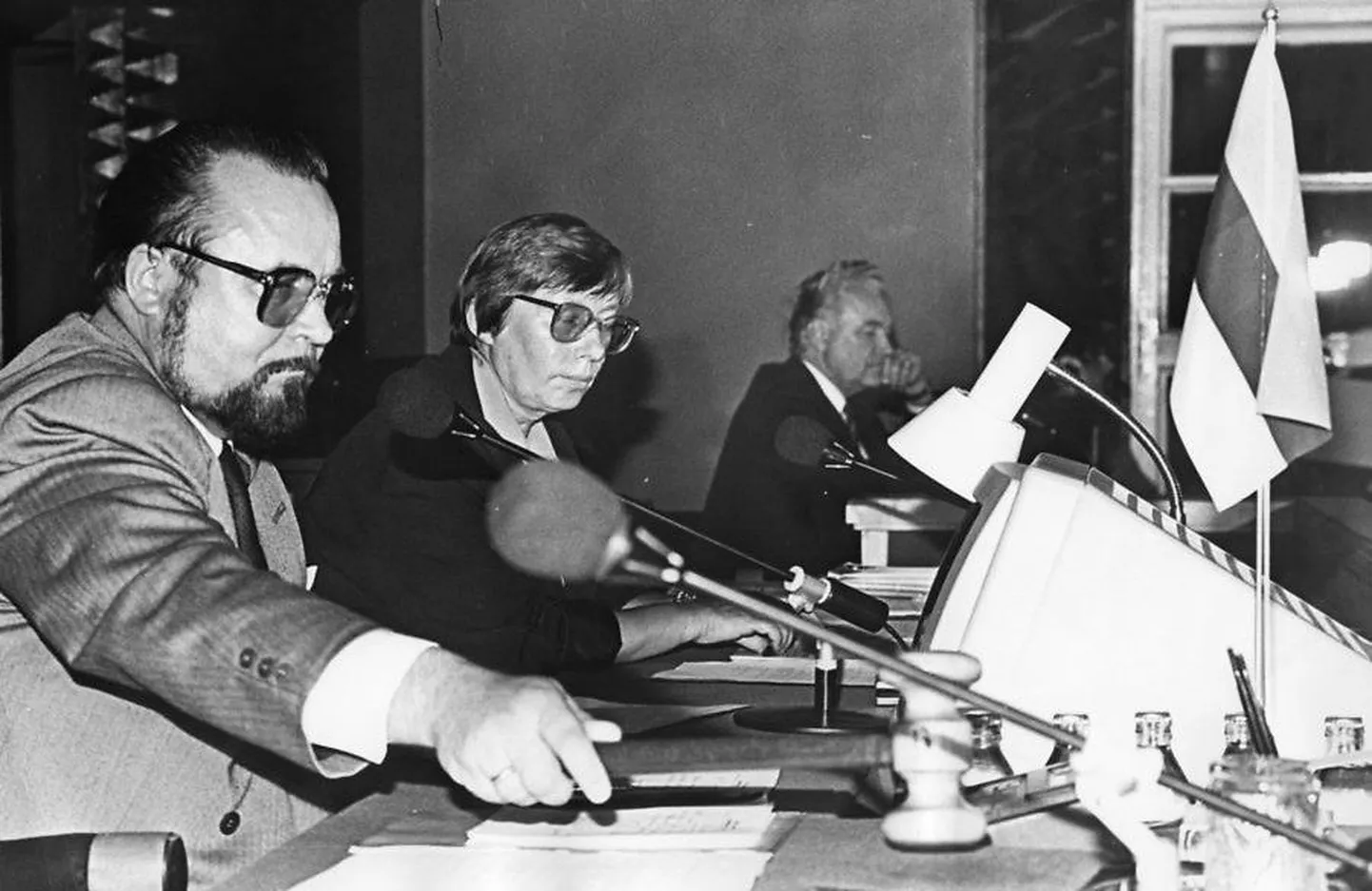 Late in the evening of August 20, 1991, the Supreme Council of the Republic of Estonia declared Estonia's national independence. In the photograph (from back to front), Chairman of the Supreme Council Arnold Rüütel is pictured alongside Vice Chair Marju Lauristin and Speaker Ülo Nugis.