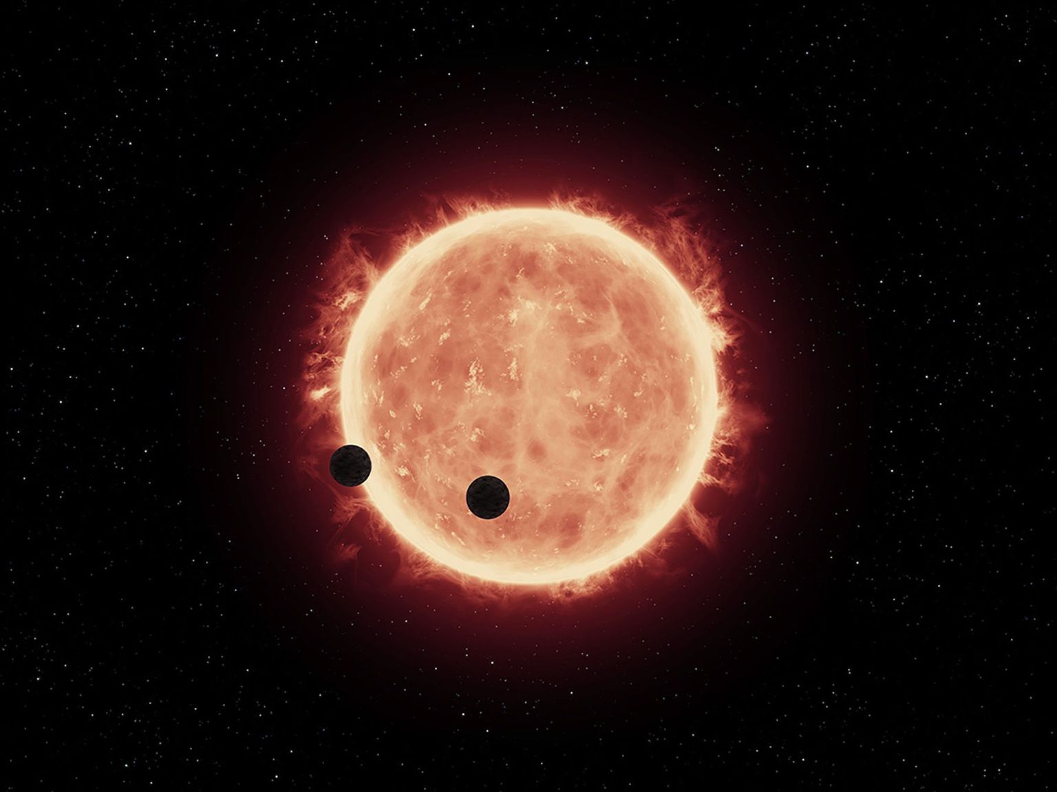NASA kunstniku kujutis ümber punase kääbuse tiirlevatest tähtedest. Oma värskes teoreetilises uuringus väidavad astrofüüsikud, et just selliste meie Päikesest 10 korda väiksemate tähtede ümbruses on elu teke kõige tõenäosem.