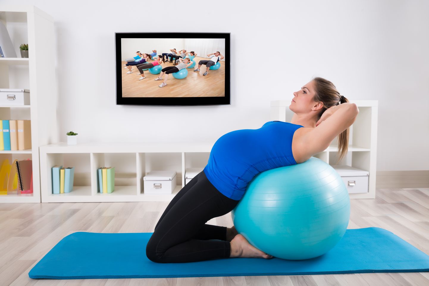 Pregnant Female Doing Workout On Fitness Ball