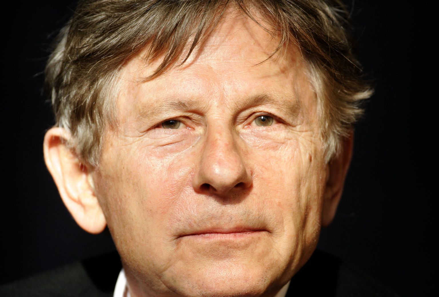 File photo of film Director Roman Polanski attending a news conference to present his musical 'Tanz der Vampire' ('Dance of the Vampires') in Berlin October 11, 2006.  Polanski was arrested on September 26, 2009 at the request of the United States on trying to enter Switzerland on Saturday evening to receive a prize, the Zurich Film Festival said in a statement on Sunday.  Polanski's arrest was in connection to an arrest warrant issued by U.S. authorities in 1978, the statement said.  REUTERS/Arnd Wiegmann/files      (GERMANY ENTERTAINMENT CRIME LAW)