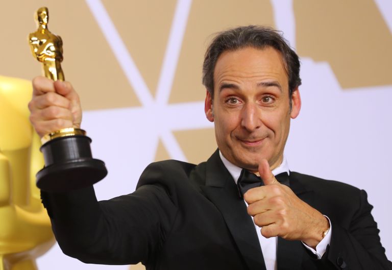 90th Academy Awards - Oscars Backstage - Hollywood, California, U.S., 04/03/2018 - Alexandre Desplat holds the Oscar for Best Original Score for "The Shape of Water." REUTERS/Mike Blake