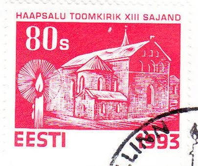 Jõulumark, millel kiriku kohal taevas väike valge täpp nagu ilutulestikurakett.