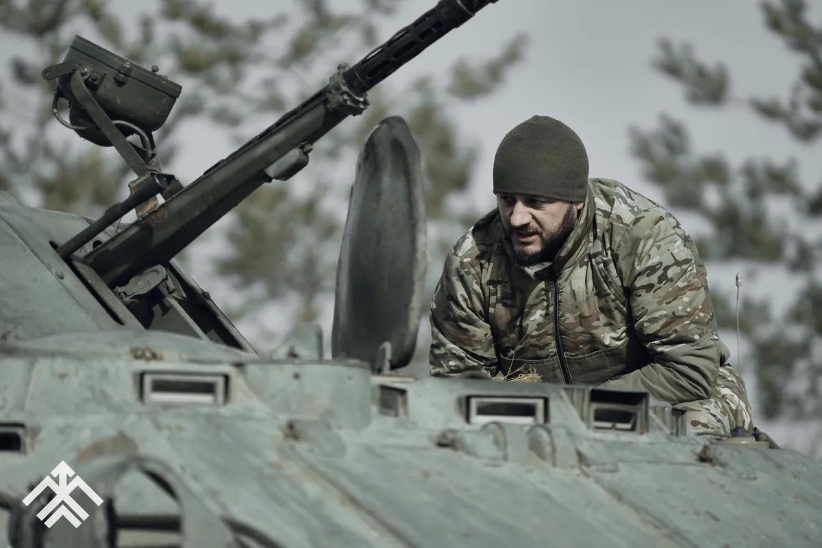 Commander of the Hartia Brigade with callsign "Kornet," inspects an armored vehicle. A successful businessman turned accomplished officer, he exemplifies leadership both on and off the battlefield.