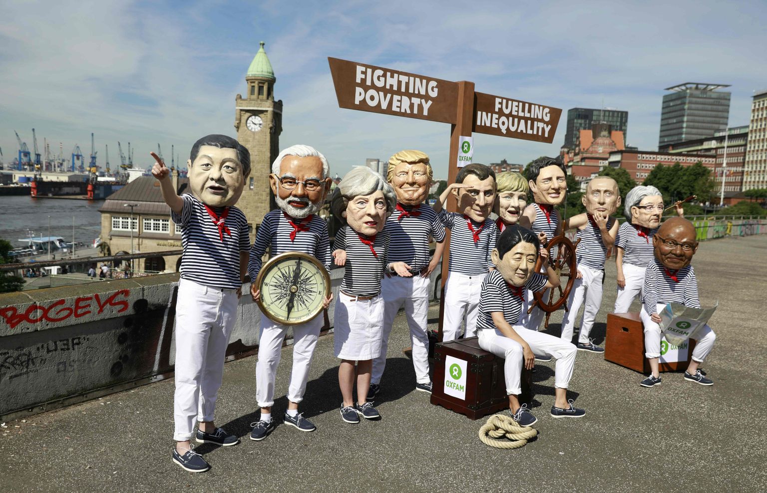 Kapitalismi-vastased aktivistid kandmas maailmaliidrite maske. Sadamalinna on koondunud aktivistid, kes protesteerivad G20 tippkohtumise vastu.