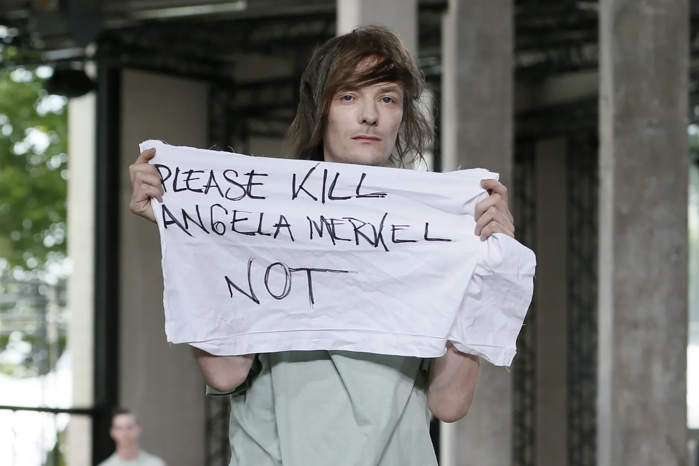 A model presents a creation by US designer Rick Owens during the men's Spring Summer collection fashion show in Paris on June 24, 2015 on June 25, 2015.  AFP PHOTO / PATRICK KOVARIK