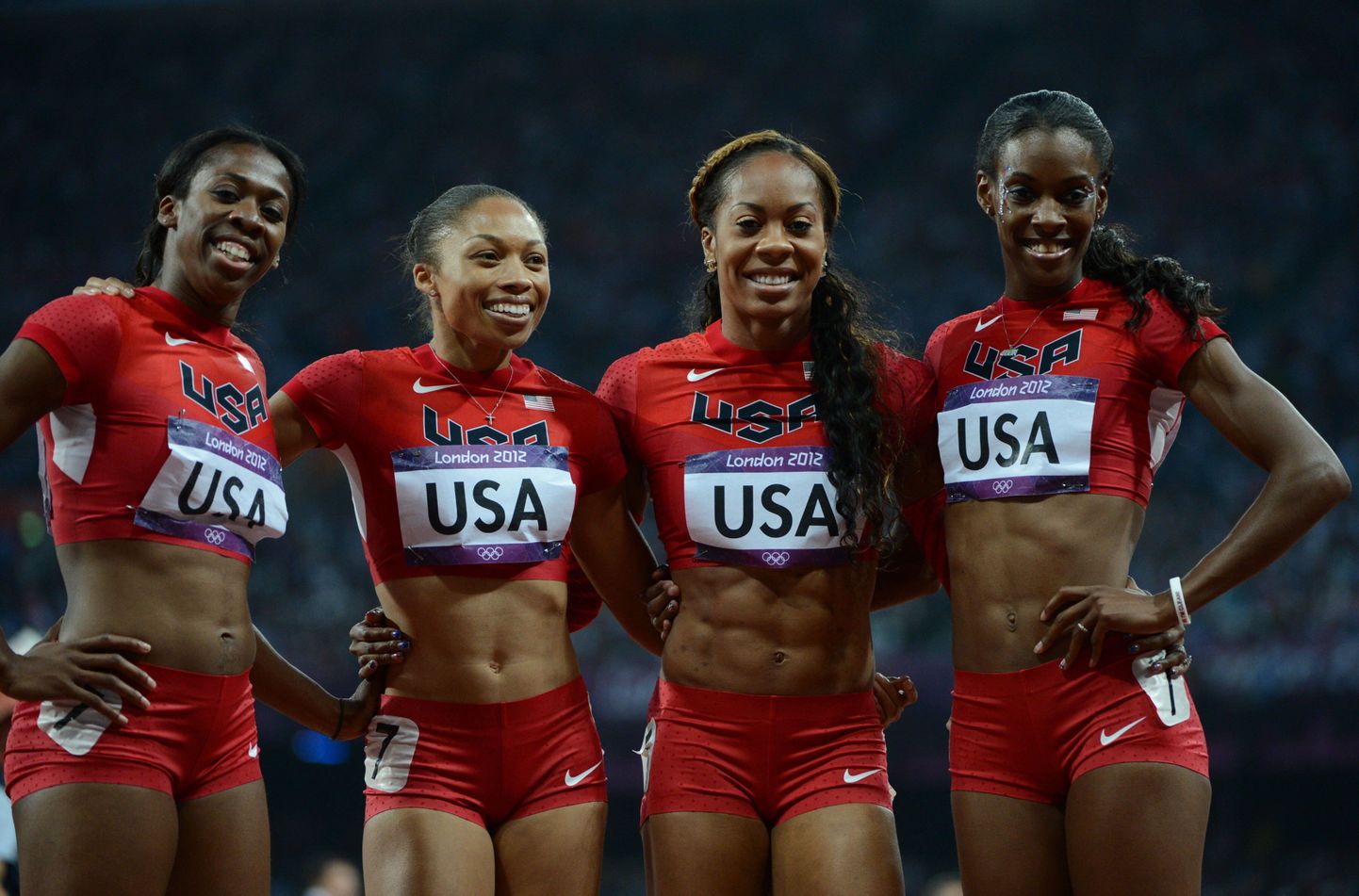 US' Francena Mccorory, US' Allyson Felix, US' Sanya Richards-Ross and US' Deedee Trotter celebrate after winning the women's 4X400 relay final at the athletics event of the London 2012 Olympic Games on August 11, 2012 in London.  AFP PHOTO / OLIVIER MORIN
