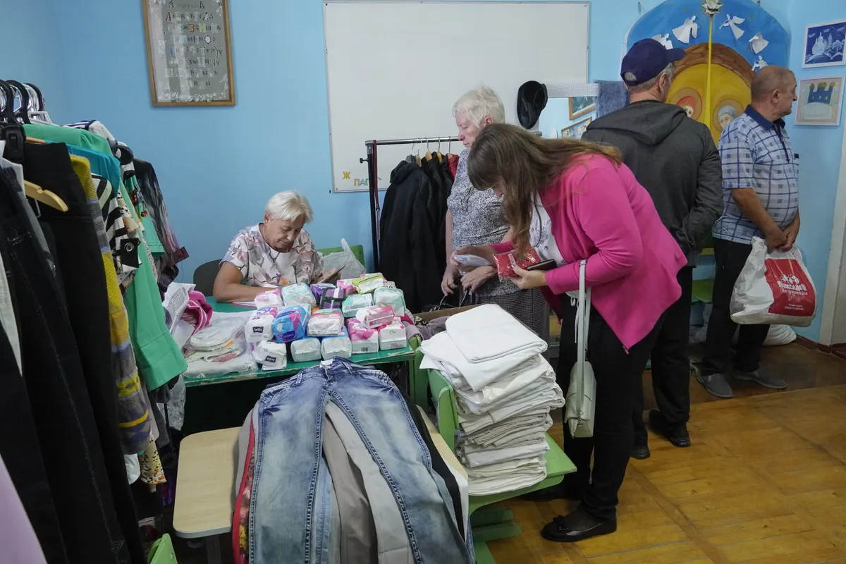 Civilians who were evacuated from the Kursk region border with Ukraine, receive humanitarian aid at the Uspensko-Nikitsky Cathedral in Kursk, Russia, 07 September 2024.