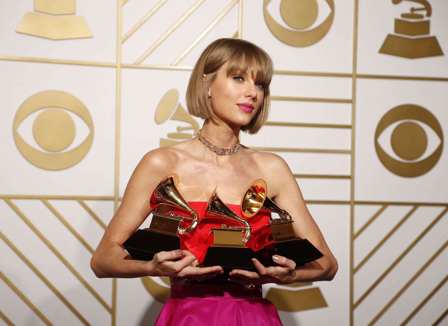 Singer Taylor Swift poses backstage with her awards for Best Music Video for "Bad Blood", Album of the Year and Best Pop Vocal Album for "1989" during the 58th Grammy Awards in Los Angeles, California February 15, 2016.  REUTERS/Lucy Nicholson