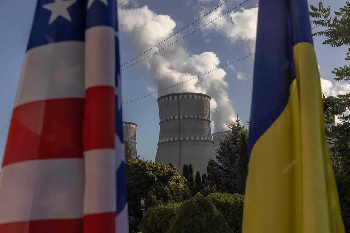 This photograph taken on September 10, 2023, shows a US flag and a Ukrainian flag in front of the Rivne Nuclear Power Plant, in Varash, Rivne region, amid the Russian invasion of Ukraine.