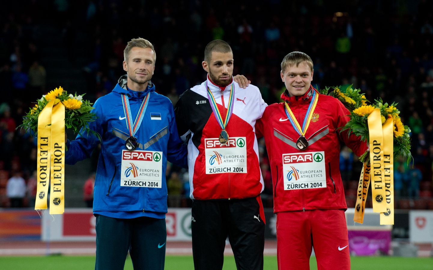 Kergejõustiku Euroopa Meistrivõistlused 2014. 400m tõkkejooksu esikolmik vasakult: teisena lõpetanud Rasmus Mägi, võitja Kariem Hussein ja kolmanda koha saanud venelane Denis Kudrjavtsev.