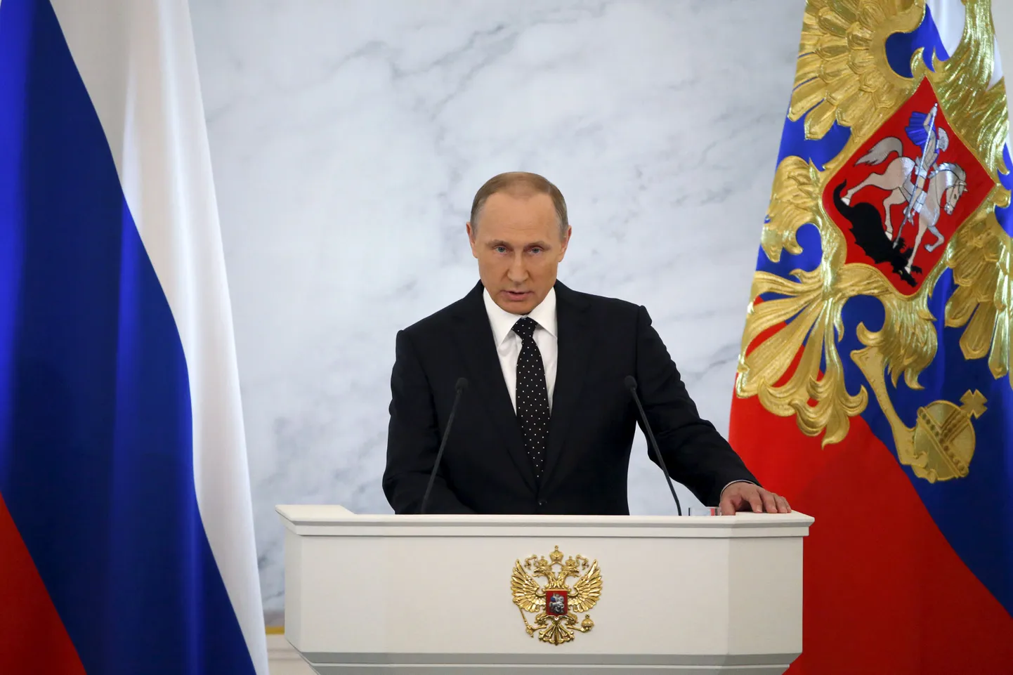 Russian President Vladimir Putin addresses the Federal Assembly, including State Duma deputies, members of the Federation Council, regional governors and civil society representatives, at the Kremlin in Moscow, Russia, December 3, 2015. Turkey will regret "more than once" about its shooting down of a Russian bomber jet near the Syrian-Turkish border, Putin said on Thursday, adding Moscow would not ignore Ankara's "aiding of terrorists".  REUTERS/Sergei Karpukhin
