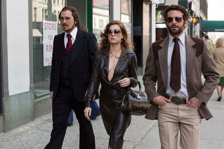 "American Hustle" - «Афера по-американски». Кристиан Бэйл, Эми Адамс и Брэдли Купер.